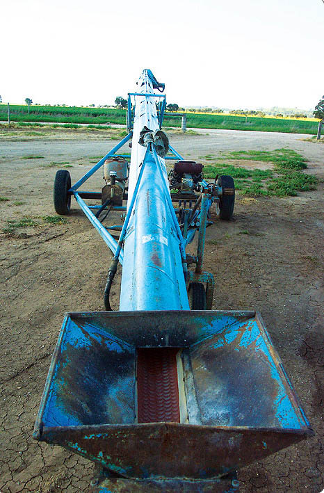 Belt shifter to safely move and elevate lentils.